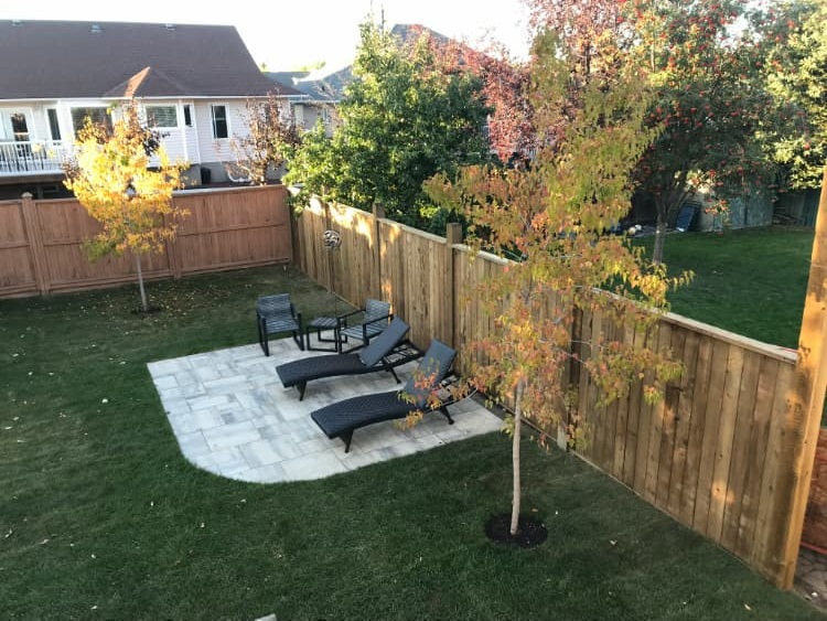 Custom cedar wood privacy fence installed for a residential property in Prince George, BC.