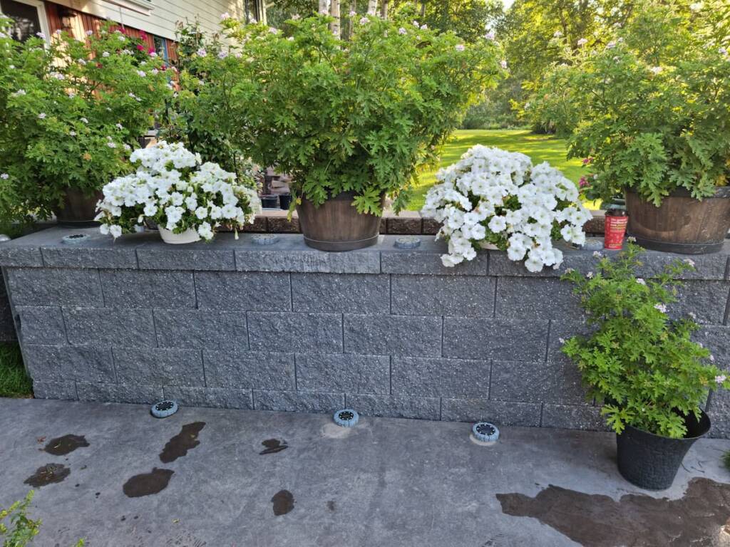 rofessional installation of a structural concrete block retaining wall by Suntree Landscaping in Prince George