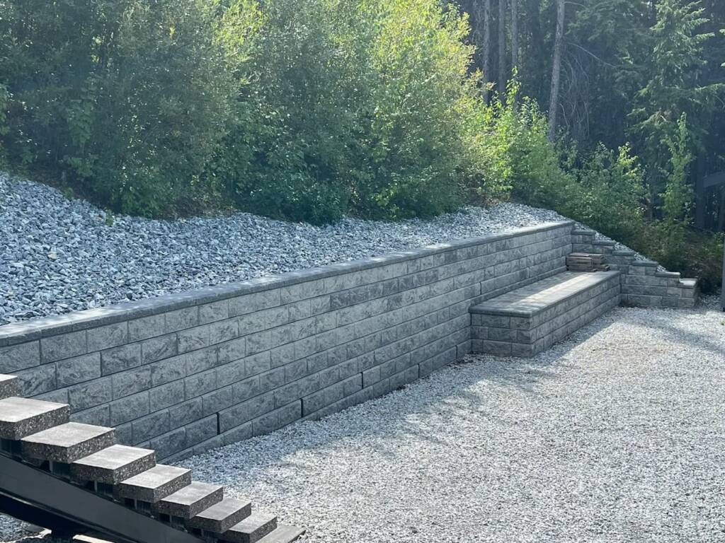 Custom stone retaining wall built by Suntree Landscaping in Prince George, BC.